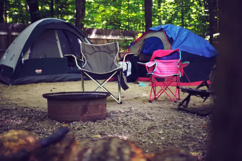 Dome tent pitched at a campsite in the evening
